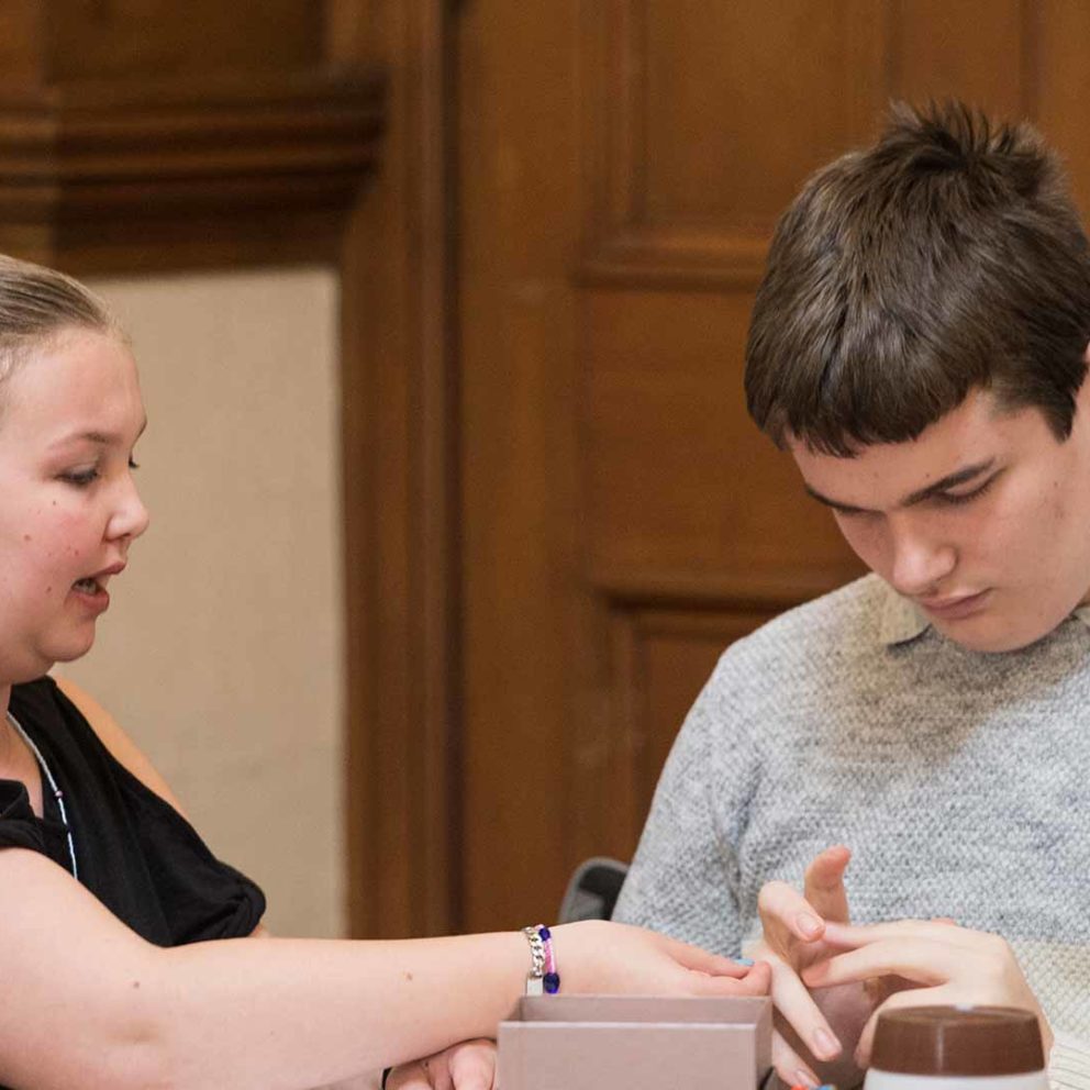 Two young people talking to each other at a Visibility Scotland event