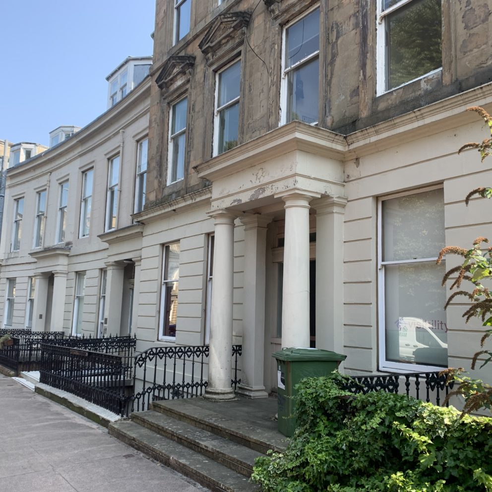 Queen's Crescent in Glasgow, a curved terrace of buildings home to Visibility Scotland's head office.