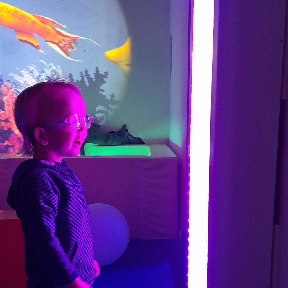 A child enjoying a sensory experience at a Little Explorers event