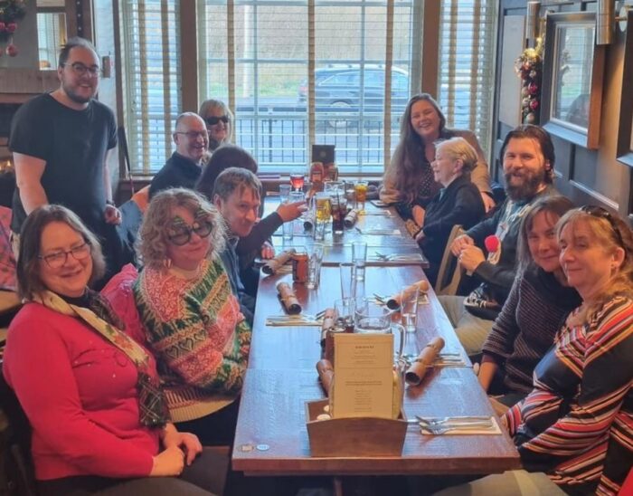 Right to Dream ambassadors sat round a table with Christmas decorations