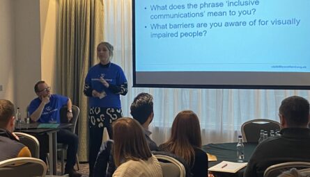Two Visibility Scotland team members delivering a session n Inclusive Communications to a group of community optometrists.