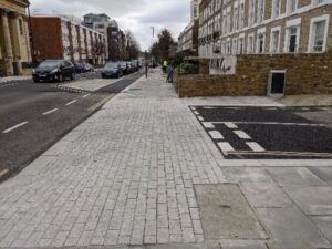 A continuous footway across a side road.