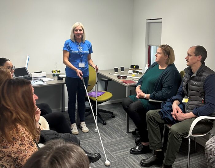 A Visibility Scotland rehabilitation specialist teaching long cane techniques