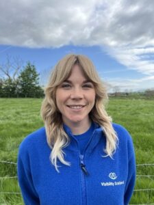 Steph smiles while wearing a blue Visibility Scotland fleece and t-shirt