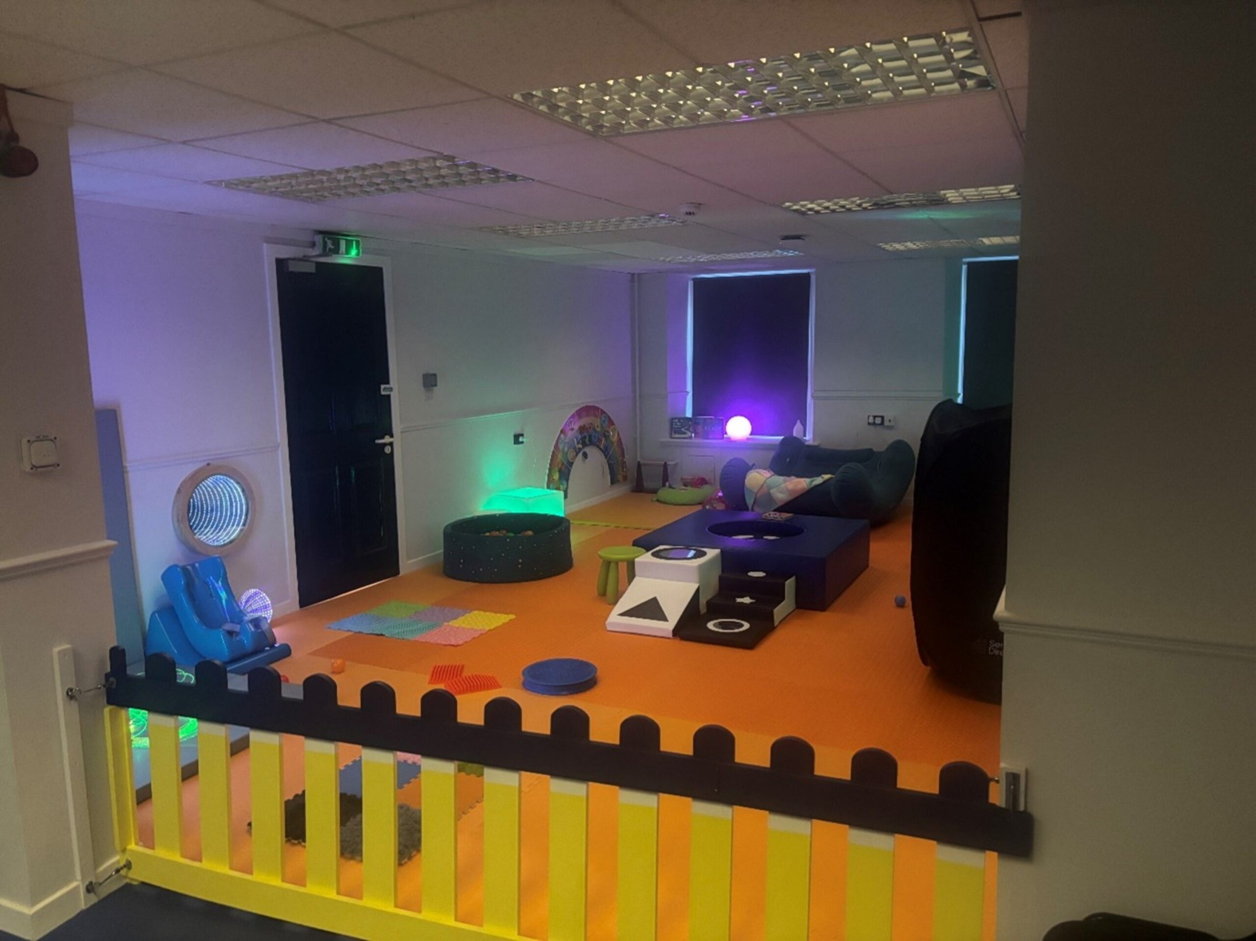 A bright, colourful, interactive sensory play area.