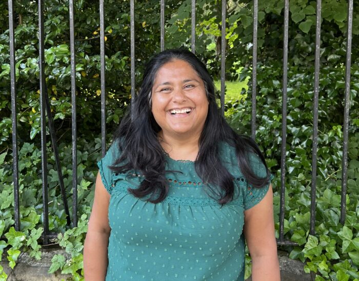 Board member Shivani stands outside smiling